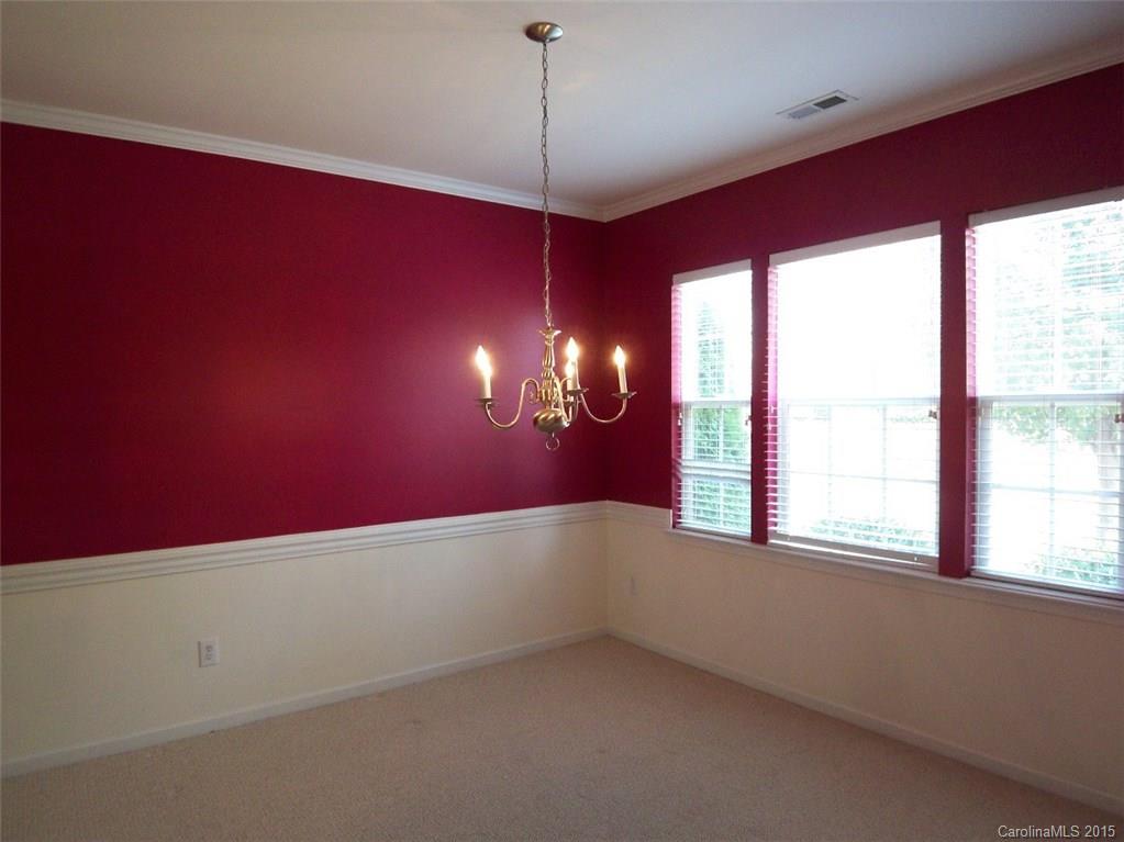 13313 Chelsea Ridge Lane Huntersville, NC 28078 - Photo 6 of 10 a view of an empty room with window and chandelier fan