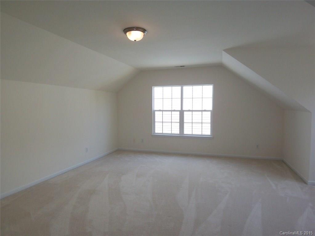 13313 Chelsea Ridge Lane Huntersville, NC 28078 - Photo 7 of 10 an empty room with a window