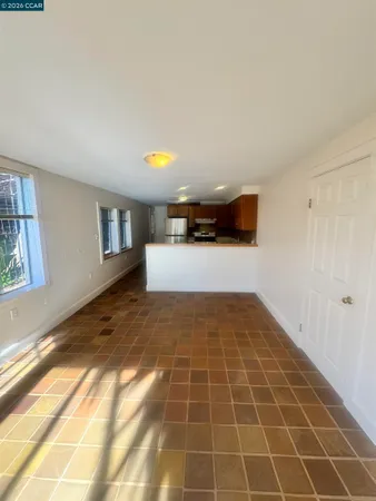 a view of an empty room and window