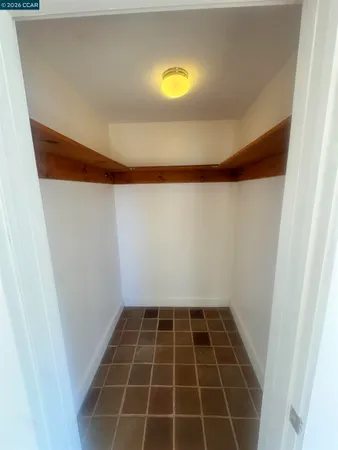 a bathroom with a toilet and a window