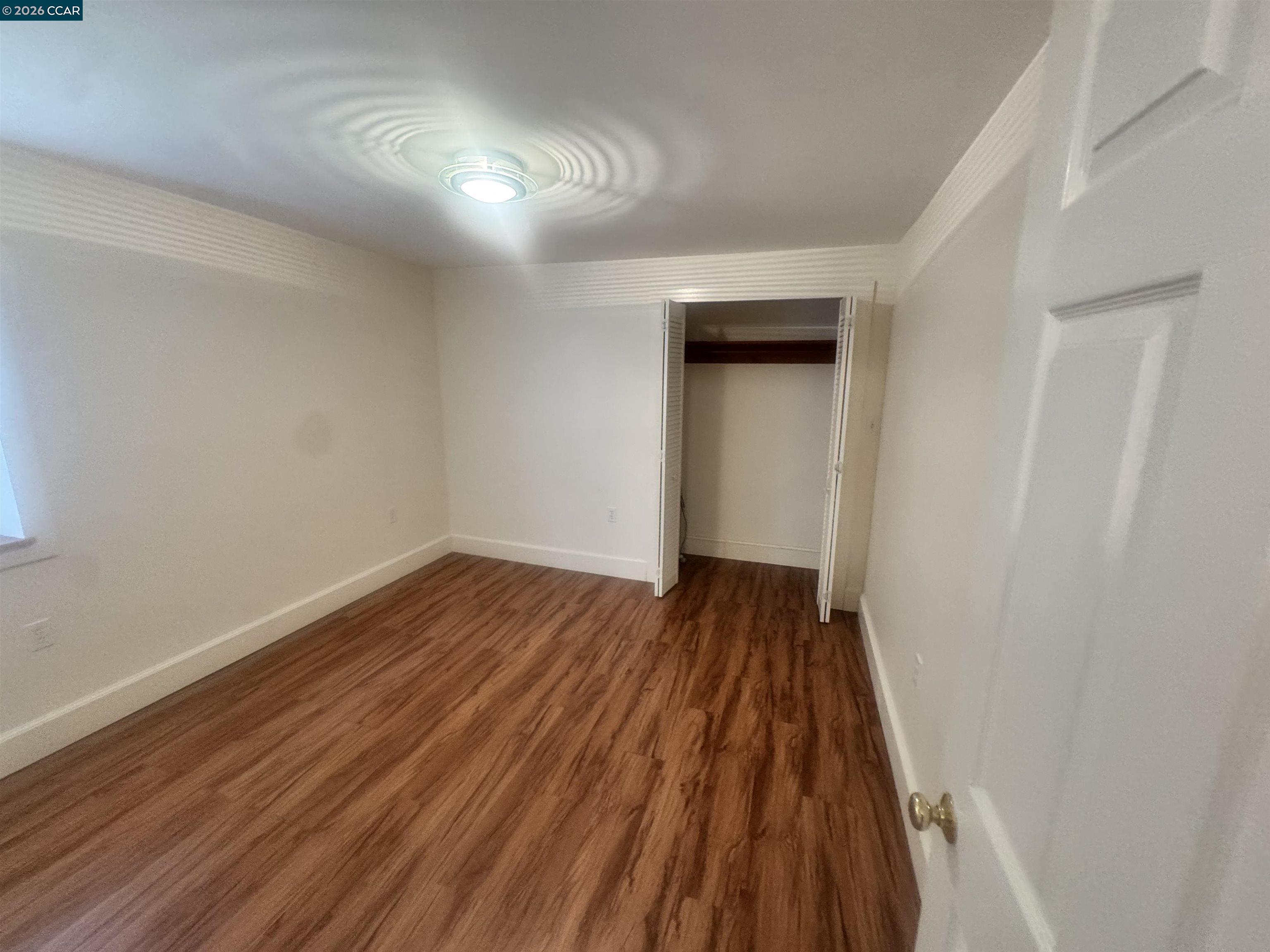 1723 Carleton Street, Unit A Berkeley, CA 94703 - Photo 24 of 32 a view of wooden floor in a room