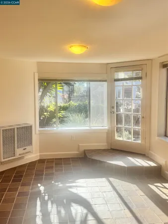a view of empty room with windows and city view