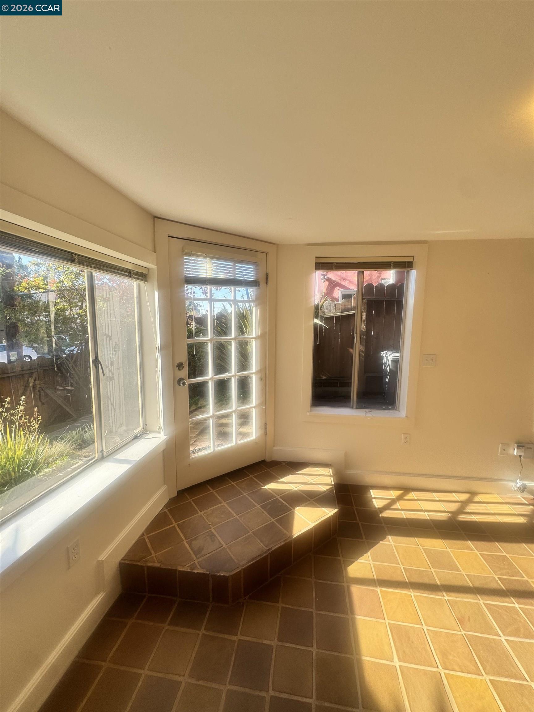 1723 Carleton Street, Unit A Berkeley, CA 94703 - Photo 8 of 32 a view of a livingroom with wooden floor and a large window
