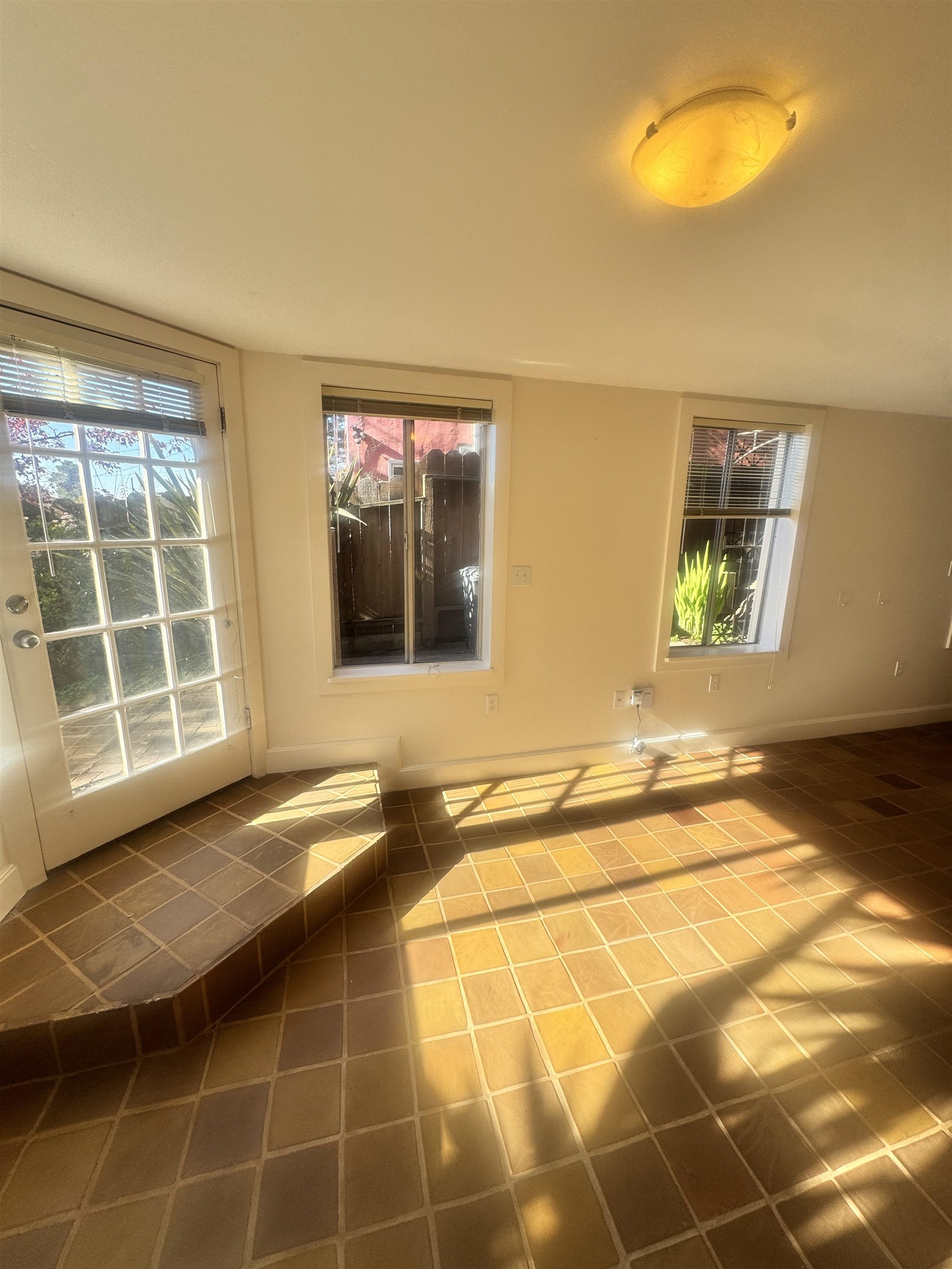 1723 Carleton Street, Unit A Berkeley, CA 94703 - Photo 9 of 32 a view of an empty room with a window