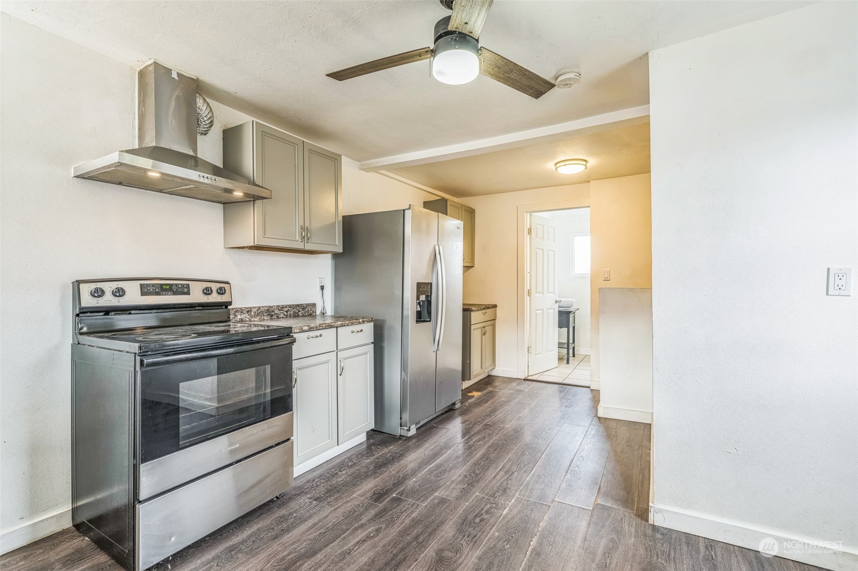 38 Viewdale Street Wenatchee, WA 98801 - Photo 8 of 34 a kitchen with stainless steel appliances a stove a refrigerator and a hard wood floor