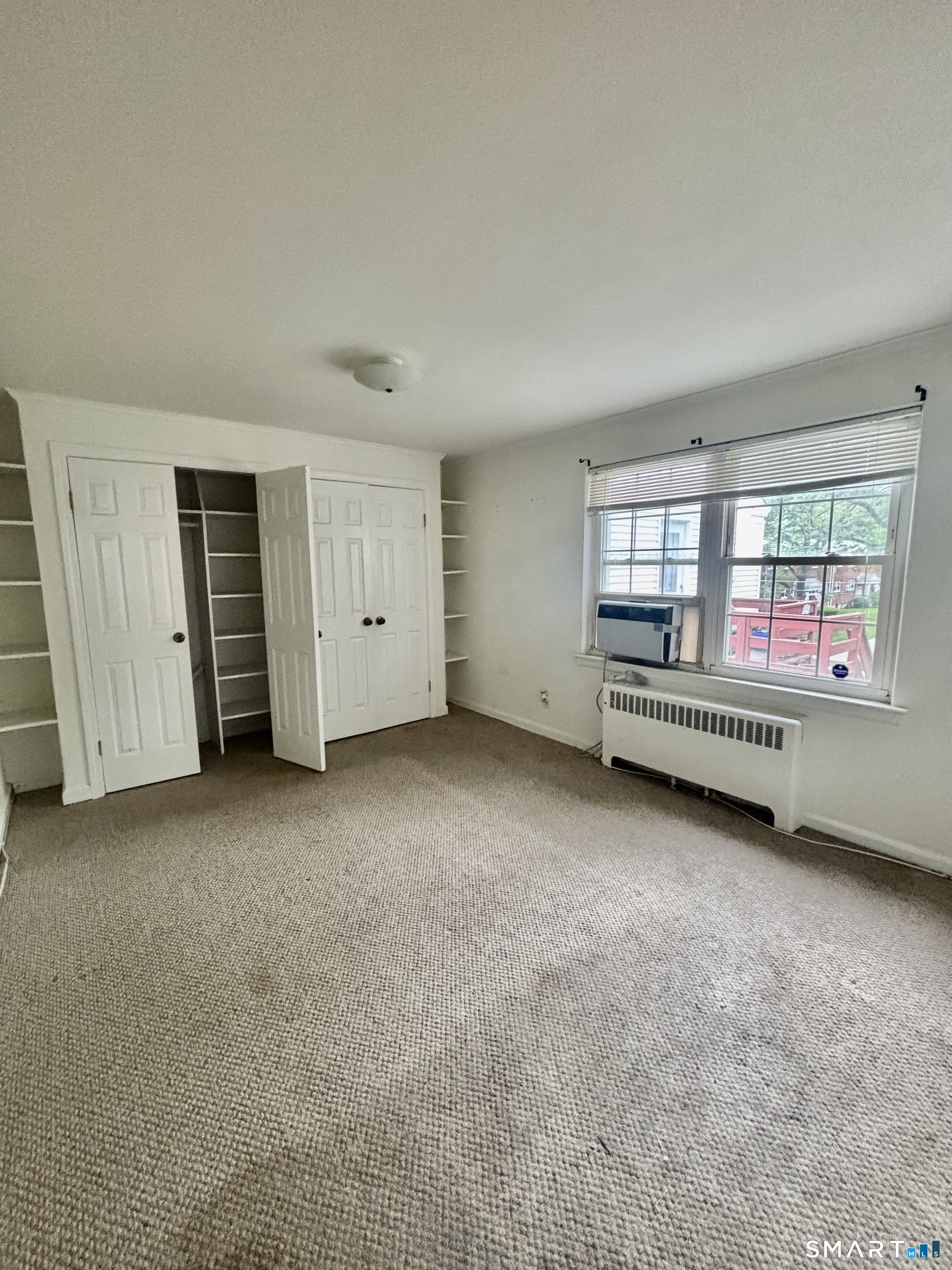 74 Standish Road, Unit 3 Stamford, CT 06902 - Photo 19 of 22 an empty room with windows