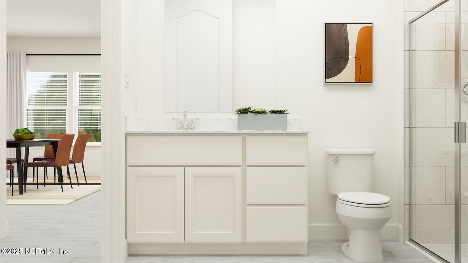 386 Hasler Avenue St. Augustine, FL 32092 - Photo 26 of 32 a bathroom with a toilet a sink and mirror