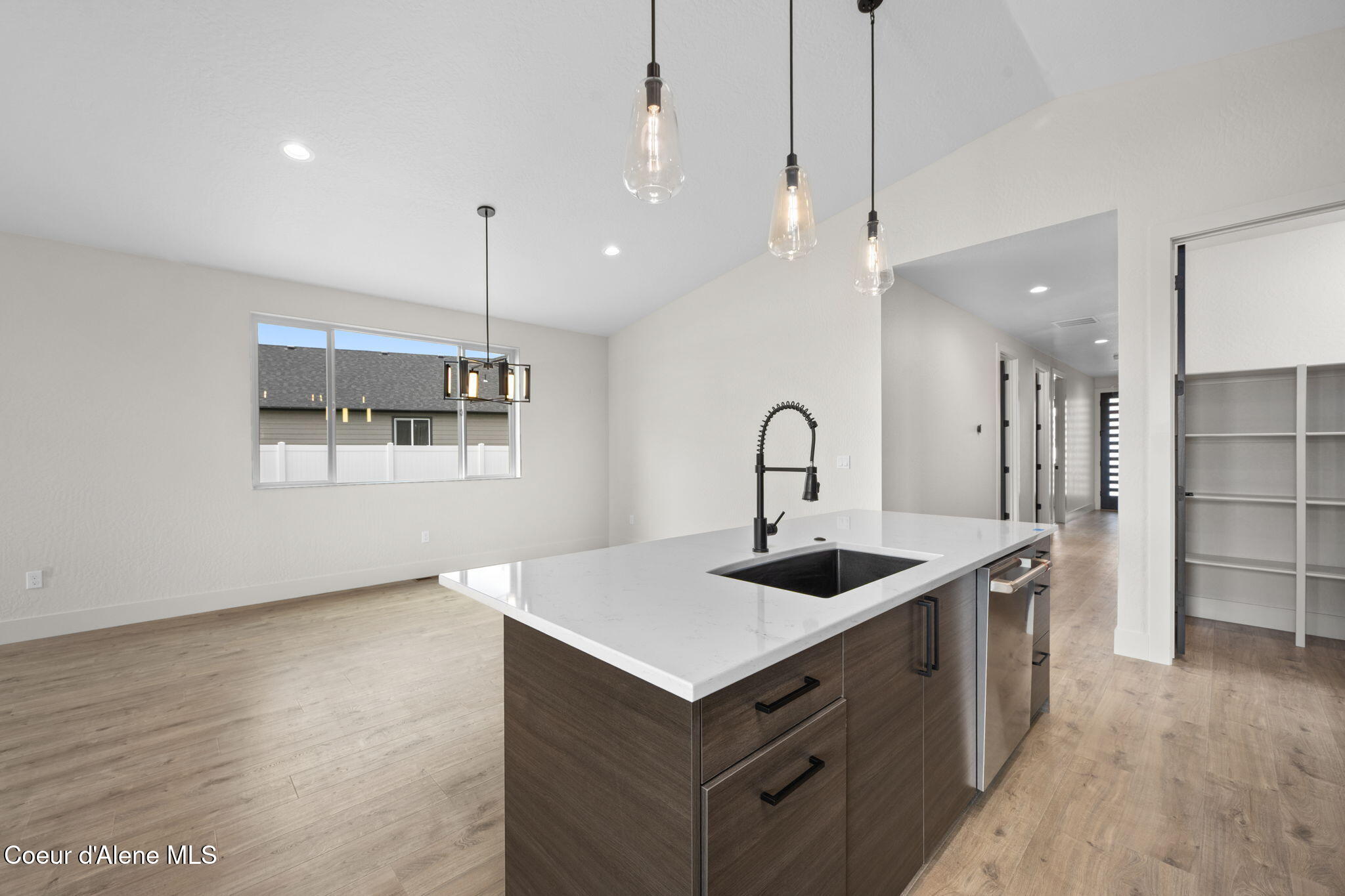 6414 West Frehley Way Rathdrum, ID 83858 - Photo 16 of 48 Kitchen Island & Dining