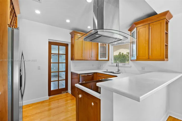 a kitchen with a sink and cabinets