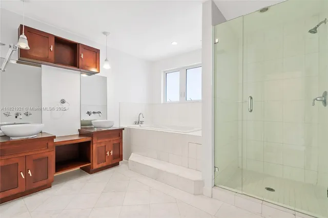 a room with a toilet sink and mirror