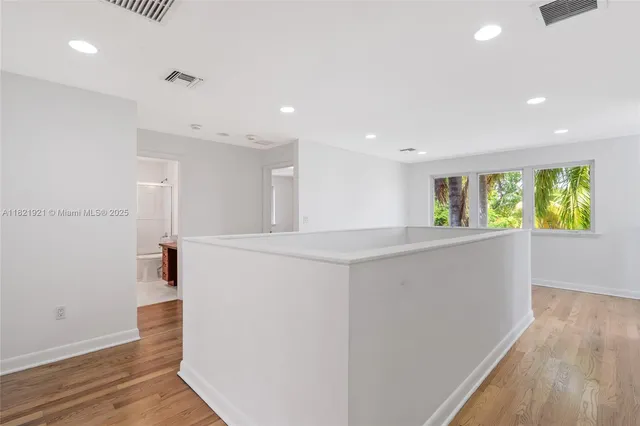 a bathroom with a bathtub and a sink