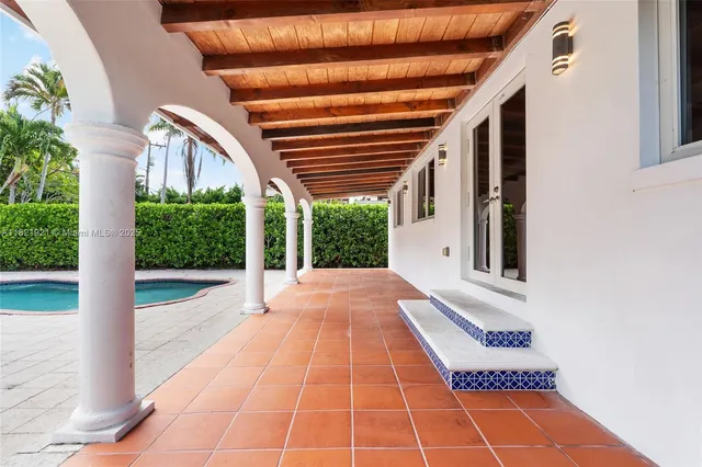 a view of a swimming pool with a yard