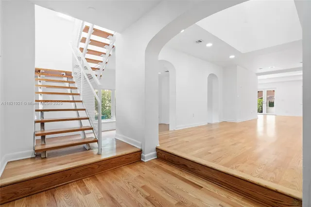 a view of a room with stairs and a rug