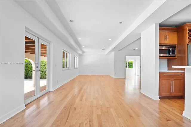a view of a kitchen cabinets and a wooden floor