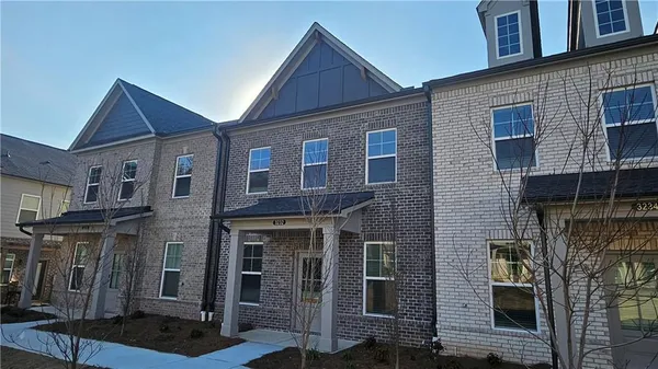 a large kitchen with kitchen island a sink stainless steel appliances and cabinets