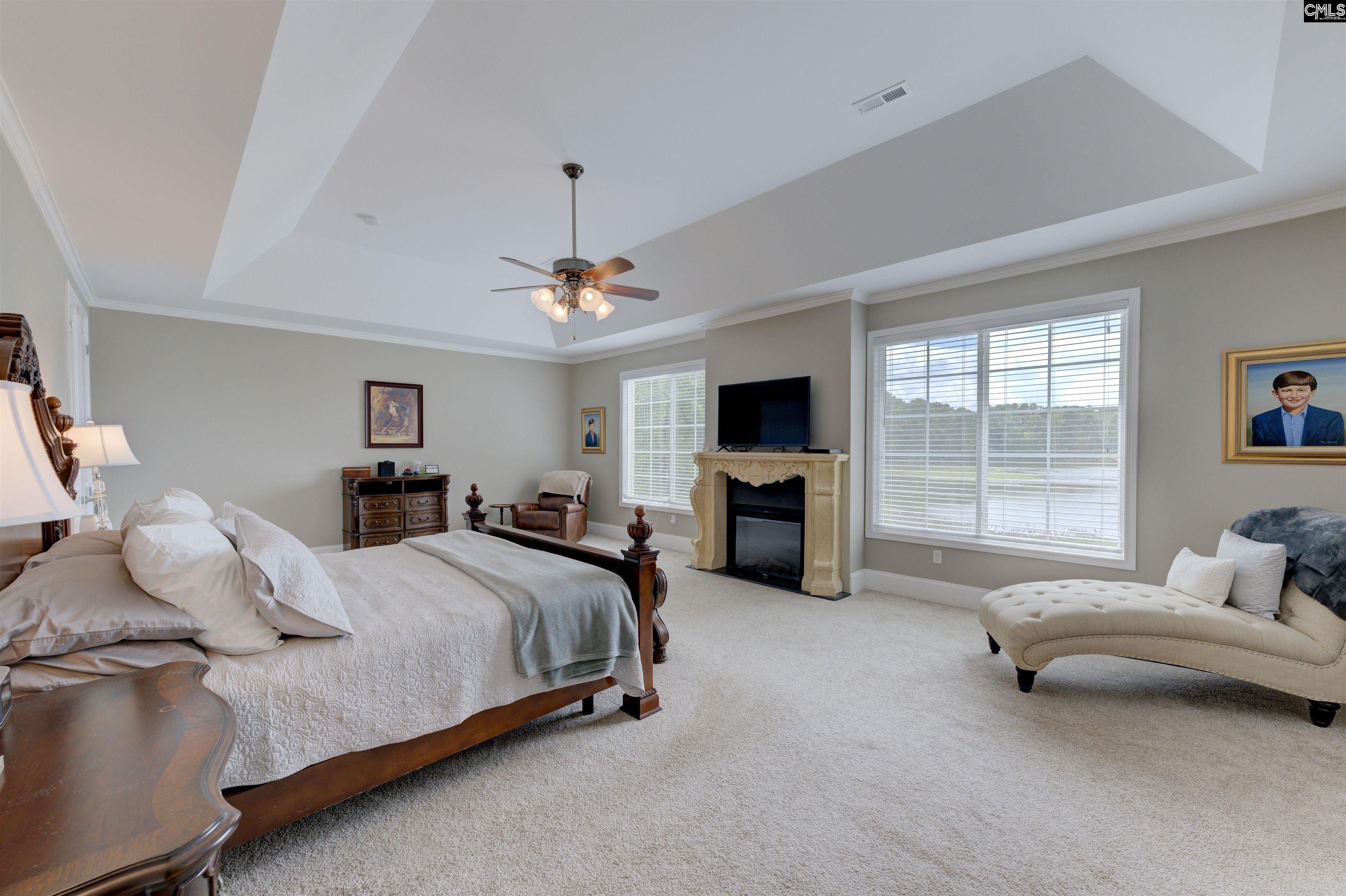 305 Northlake Road Columbia, SC 29223 - Photo 28 of 46 a spacious bedroom with a bed and glass window