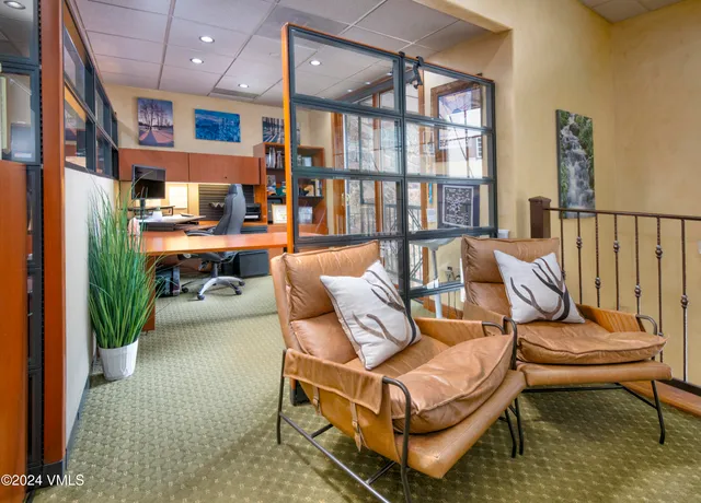 a room with furniture pool table and flat screen tv