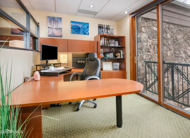 a laptop computer sitting on top of a desk