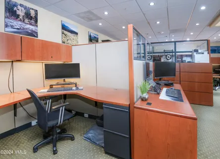 a view of a workspace with furniture