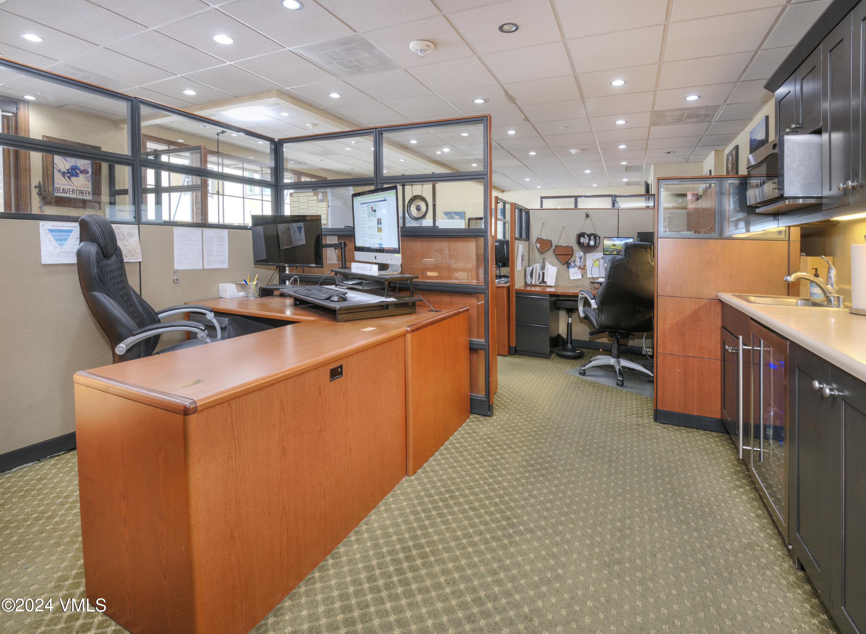 63 Avondale Lane, Unit C001 Beaver Creek, CO 81620 - Photo 19 of 24 a kitchen with stainless steel appliances granite countertop a sink a stove and a refrigerator