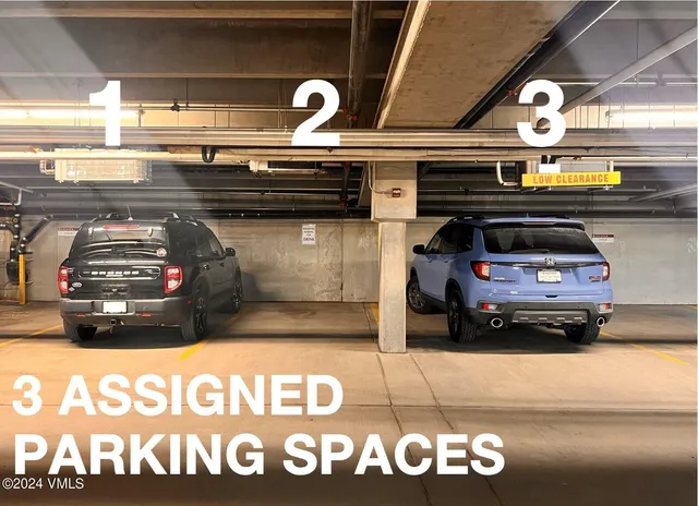 a front view of a residential apartment building with a yard