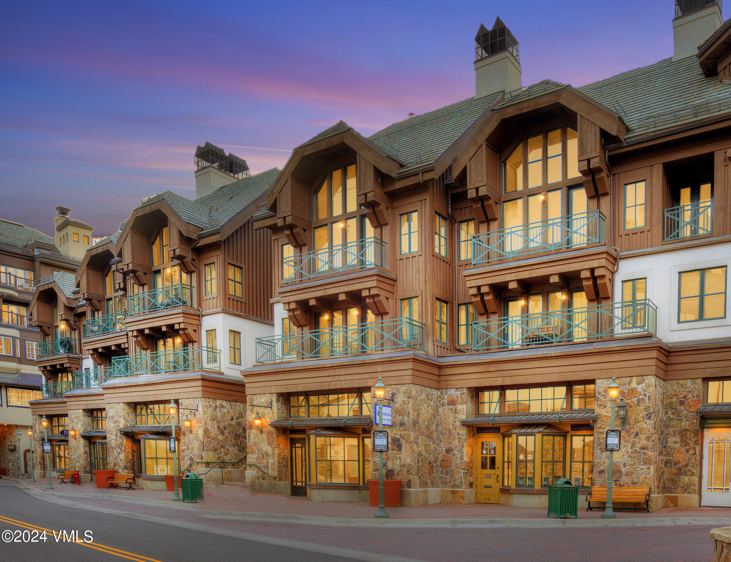 63 Avondale Lane, Unit C001 Beaver Creek, CO 81620 - Photo 3 of 24 a front view of a residential apartment building with a yard