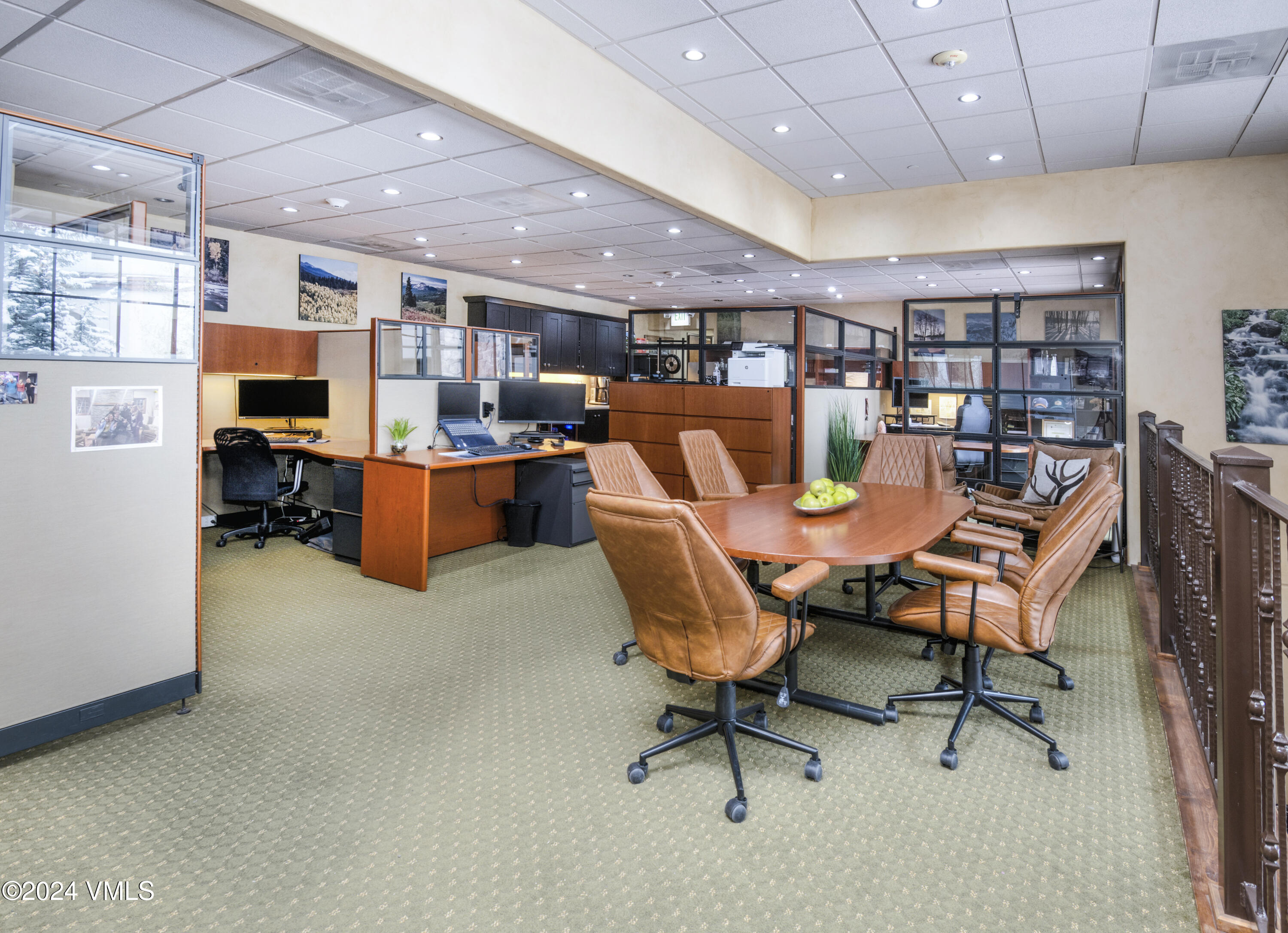 63 Avondale Lane, Unit C001 Beaver Creek, CO 81620 - Photo 5 of 24 a dining room with lots of furniture and a bookshelf