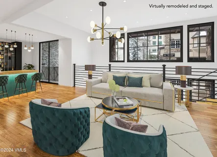 a dining room with furniture and a chandelier