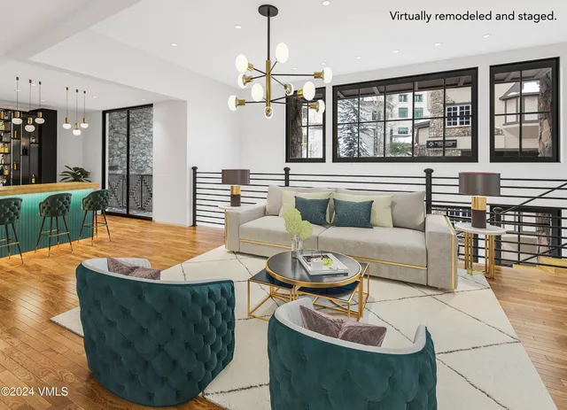 a dining room with furniture and a chandelier