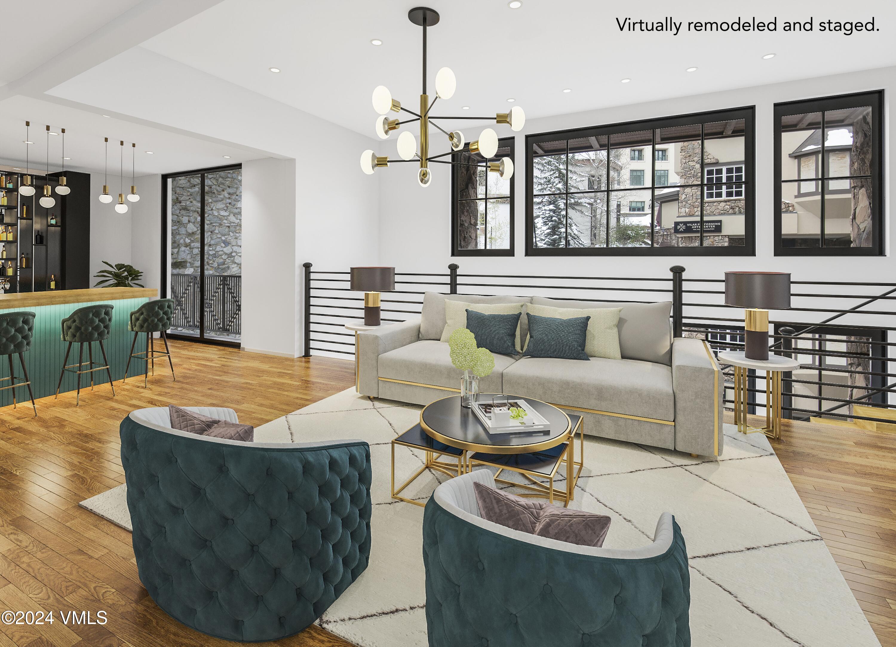 63 Avondale Lane, Unit C001 Beaver Creek, CO 81620 - Photo 8 of 24 a living room with furniture and a chandelier