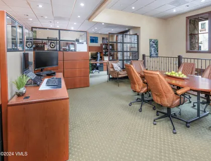 a kitchen with stainless steel appliances granite countertop a refrigerator a sink and a stove