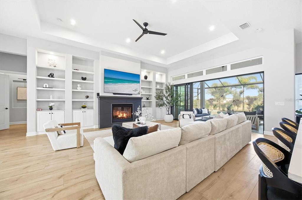 15013 Montello Way Bradenton, FL 34211 - Photo 15 of 100 a living room with furniture fireplace and a large window