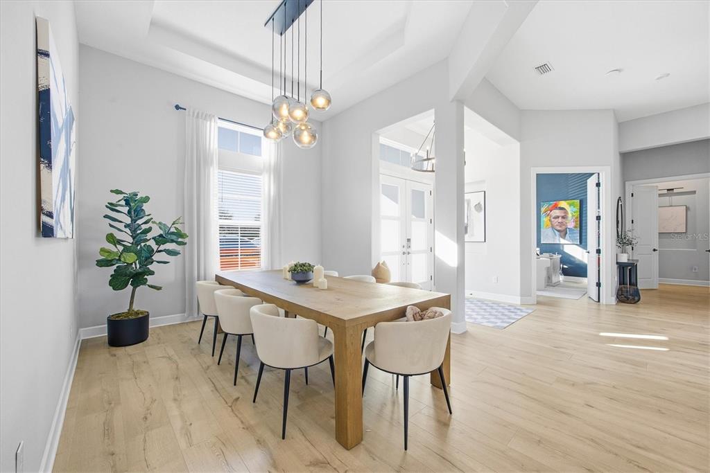 15013 Montello Way Bradenton, FL 34211 - Photo 19 of 100 a view of a dining room with furniture and wooden floor