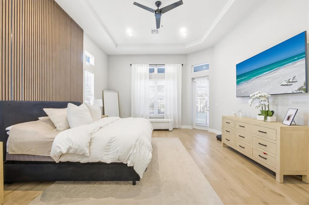 15013 Montello Way Bradenton, FL 34211 - Photo 26 of 100 a spacious bedroom with a bed and window