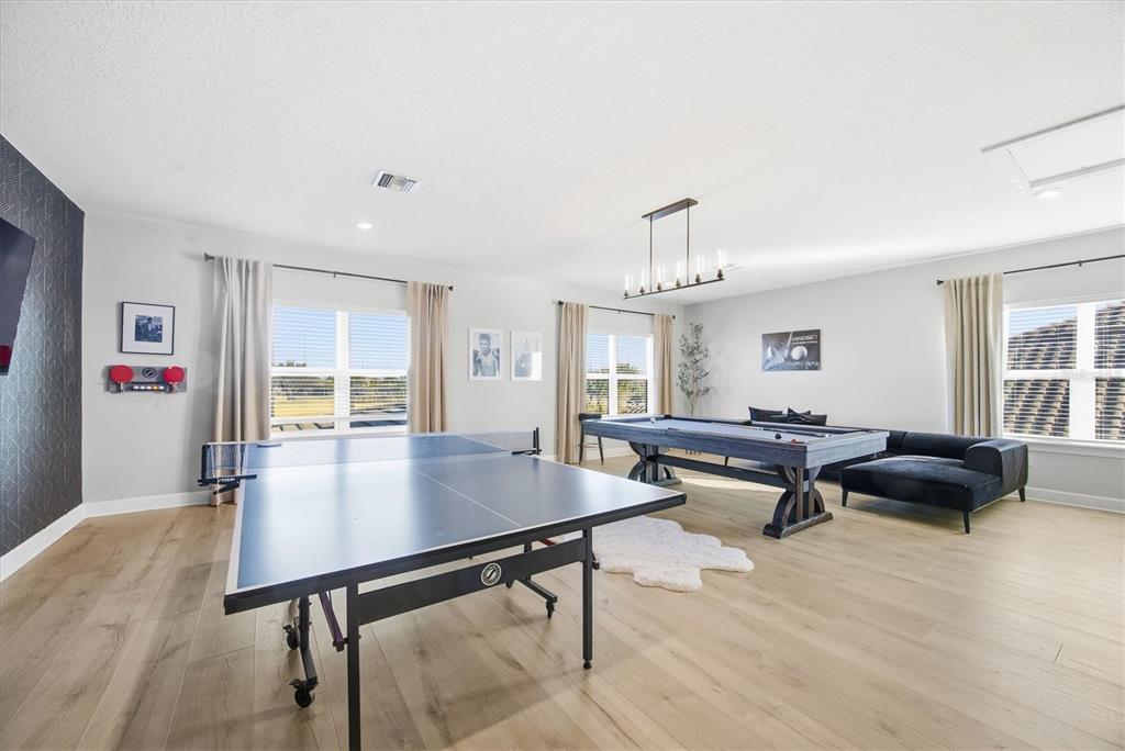 15013 Montello Way Bradenton, FL 34211 - Photo 38 of 100 a living room with furniture a table and large window