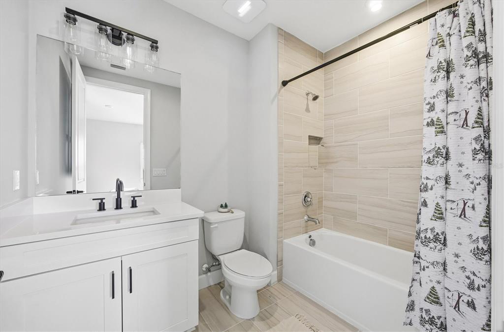 15013 Montello Way Bradenton, FL 34211 - Photo 44 of 100 a bathroom with a sink toilet and shower