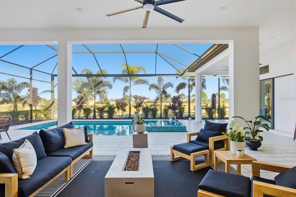 15013 Montello Way Bradenton, FL 34211 - Photo 46 of 100 a living room with furniture a rug and a window
