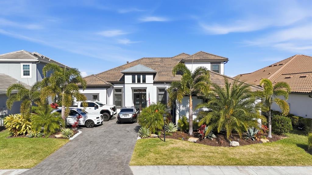 15013 Montello Way Bradenton, FL 34211 - Photo 5 of 100 a front view of a house with garden