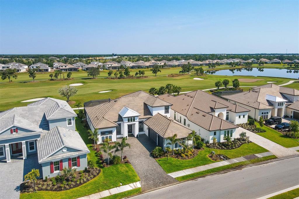 15013 Montello Way Bradenton, FL 34211 - Photo 6 of 100 an aerial view of a house with a swimming pool yard and outdoor seating