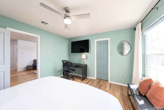 a view of a house with a backyard