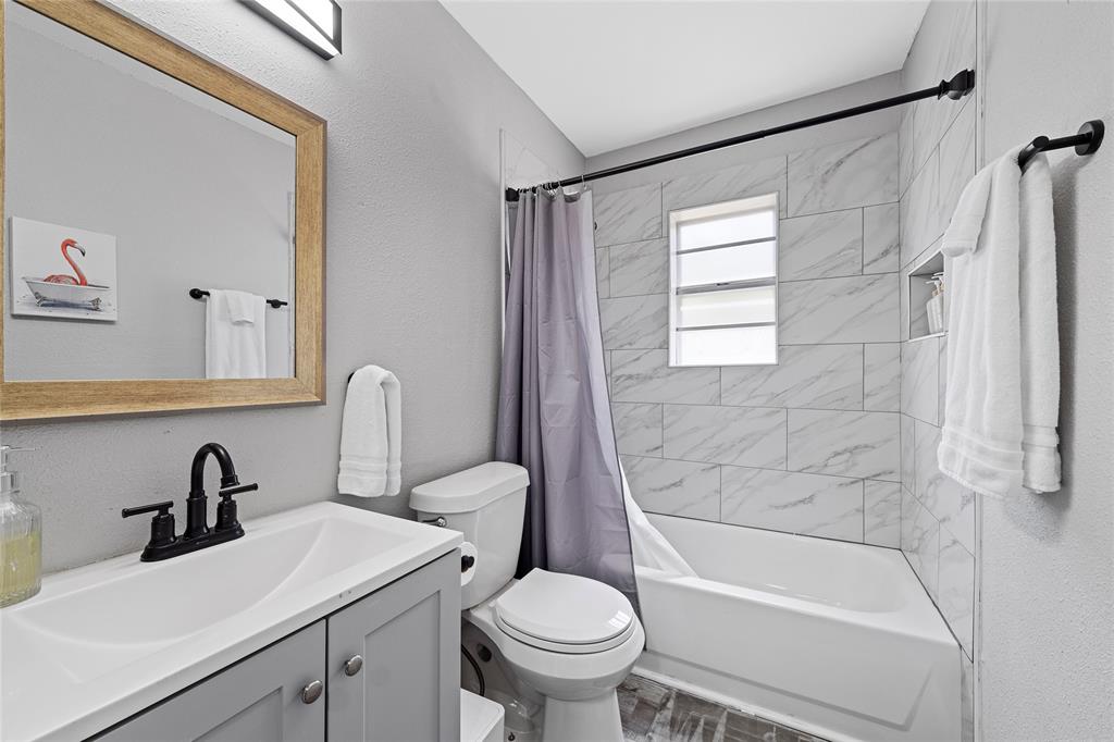 1900 North 6th Street Waco, TX 76708 - Photo 11 of 23 a bathroom with a sink toilet and shower