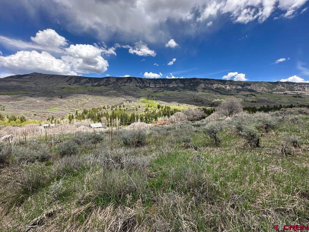 289 Eagles Rest Montrose, CO 81220 - Photo 5 of 8 a view of a lake with sunset in background