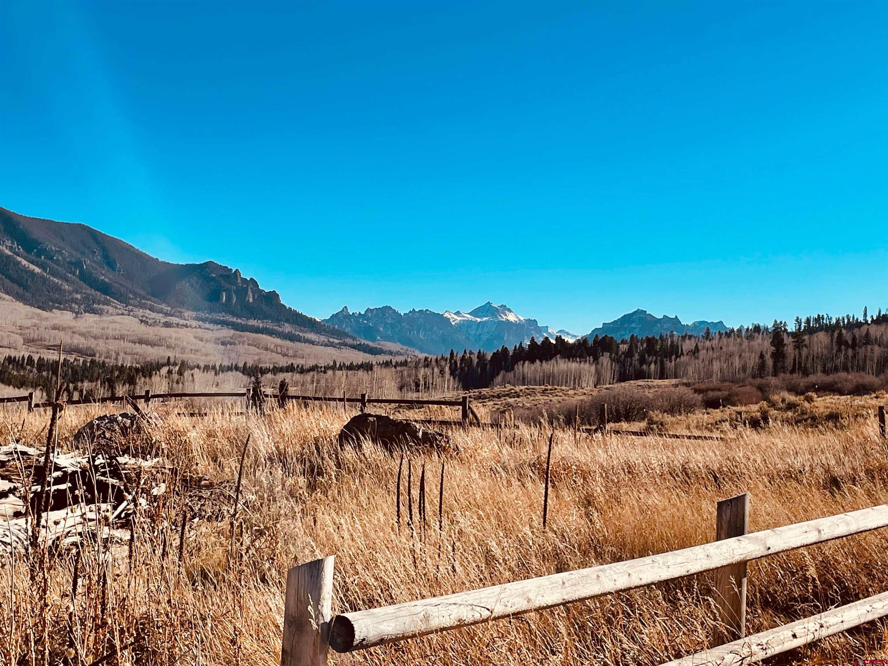 289 Eagles Rest Montrose, CO 81220 - Photo 7 of 8 a view of a lake with a mountain