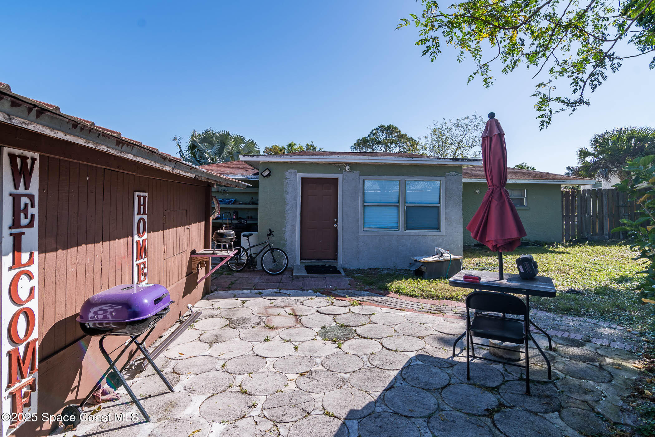 722 Venus Drive Cocoa, FL 32926 - Photo 15 of 17 a view of backyard with furniture and a tub