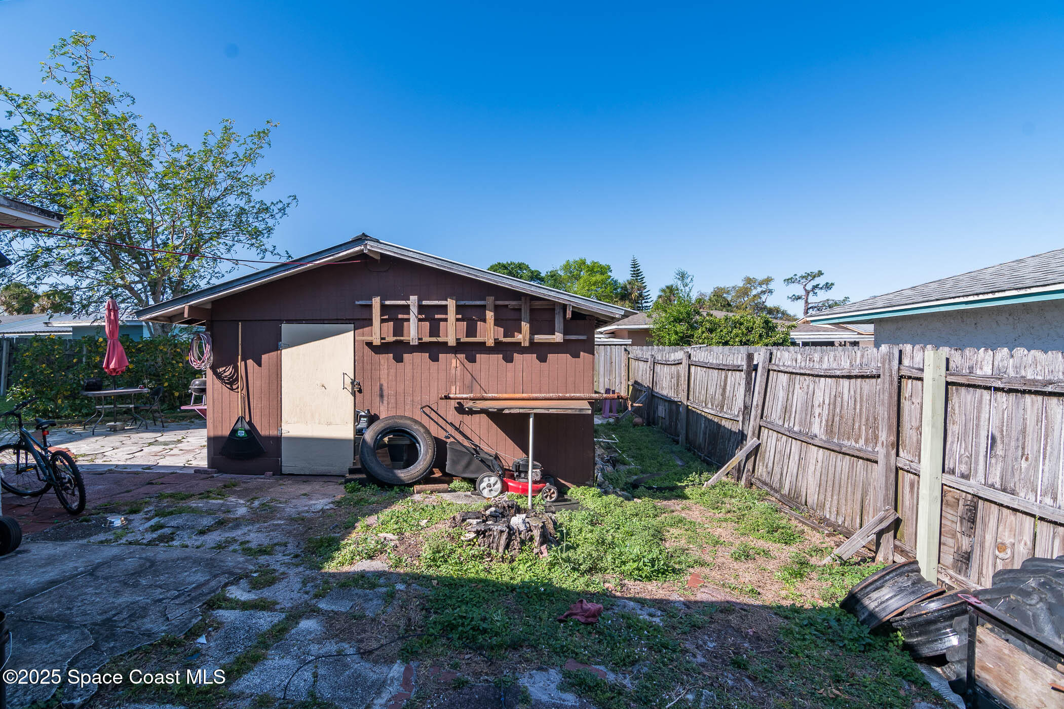 722 Venus Drive Cocoa, FL 32926 - Photo 3 of 17 a view of a house with wooden fence