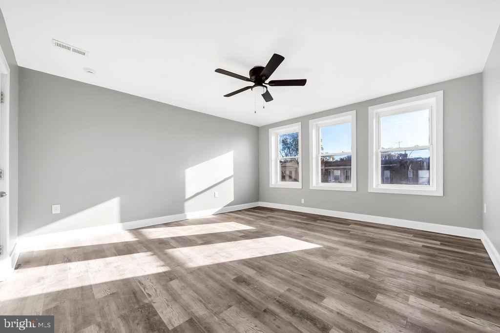 606 South 52nd Street Philadelphia, PA 19143 - Photo 14 of 16 a view of a livingroom with a window and a ceiling fan