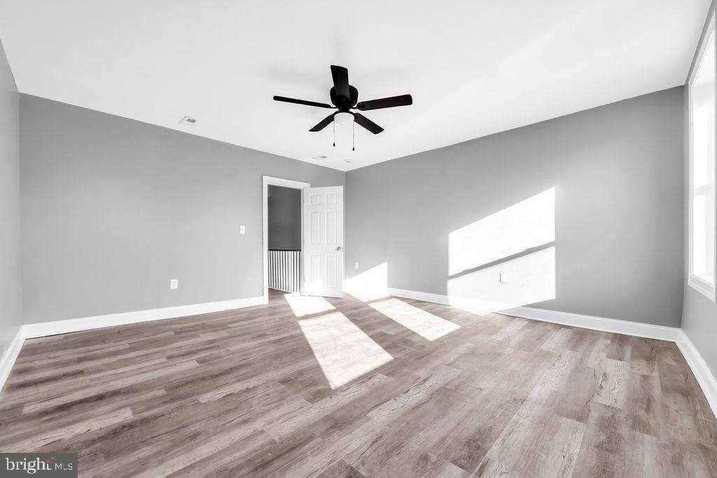 606 South 52nd Street Philadelphia, PA 19143 - Photo 15 of 16 a view of an empty room and window and a ceiling fan