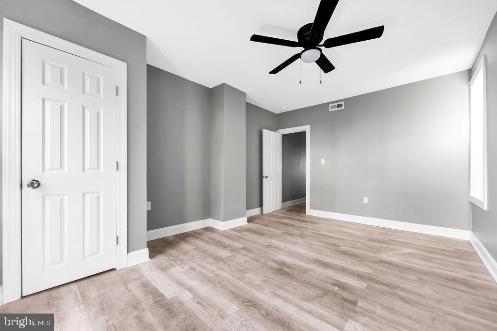 606 South 52nd Street Philadelphia, PA 19143 - Photo 5 of 16 a view of an empty room with a ceiling fan