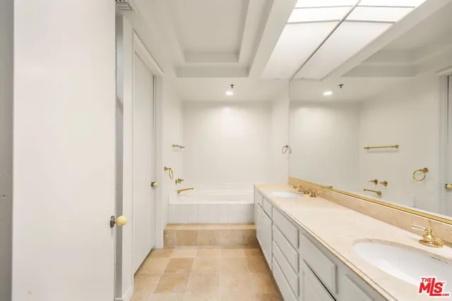 a bathroom with a bathtub and a sink