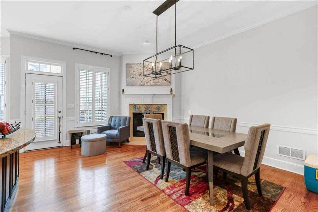 4712 Ivy Ridge Drive Southeast Atlanta, GA 30339 - Photo 18 of 82 a view of a dining room with furniture wooden floor and chandelier